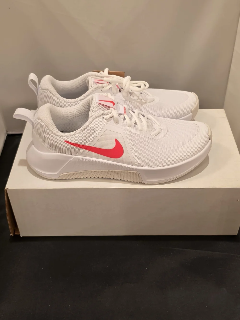 Nike Women's White Athletic Sneakers with Pink Swoosh